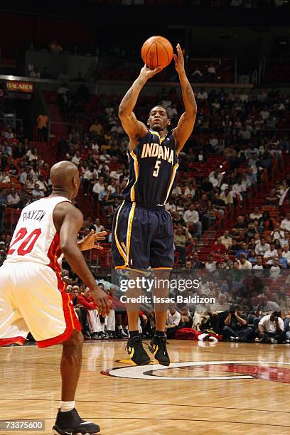 Orien Greene of the Indiana Pacers shoots a jump shot over Gary Payton of the Miami Heat during a game at American Airlines Arena on January 18, 2007...