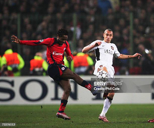 Henrik Larsson of Manchester United tackles Jean II Makoun of Lille during the Champions League Round of 16, first leg between Lille and Manchester...