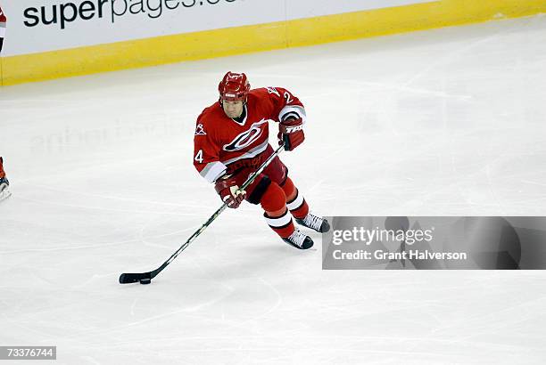 Scott Walker of the Carolina Hurricanes skates with the puck against the Los Angeles Kings on February 13, 2007 at the RBC Center in Raleigh, North...