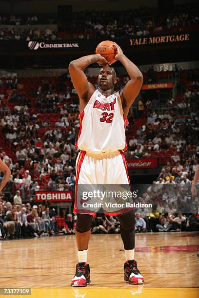 Shaquille O'Neal of the Miami Heat prepares to shoot a free throw during a game against the Cleveland Cavaliers at American Airlines Arena on...