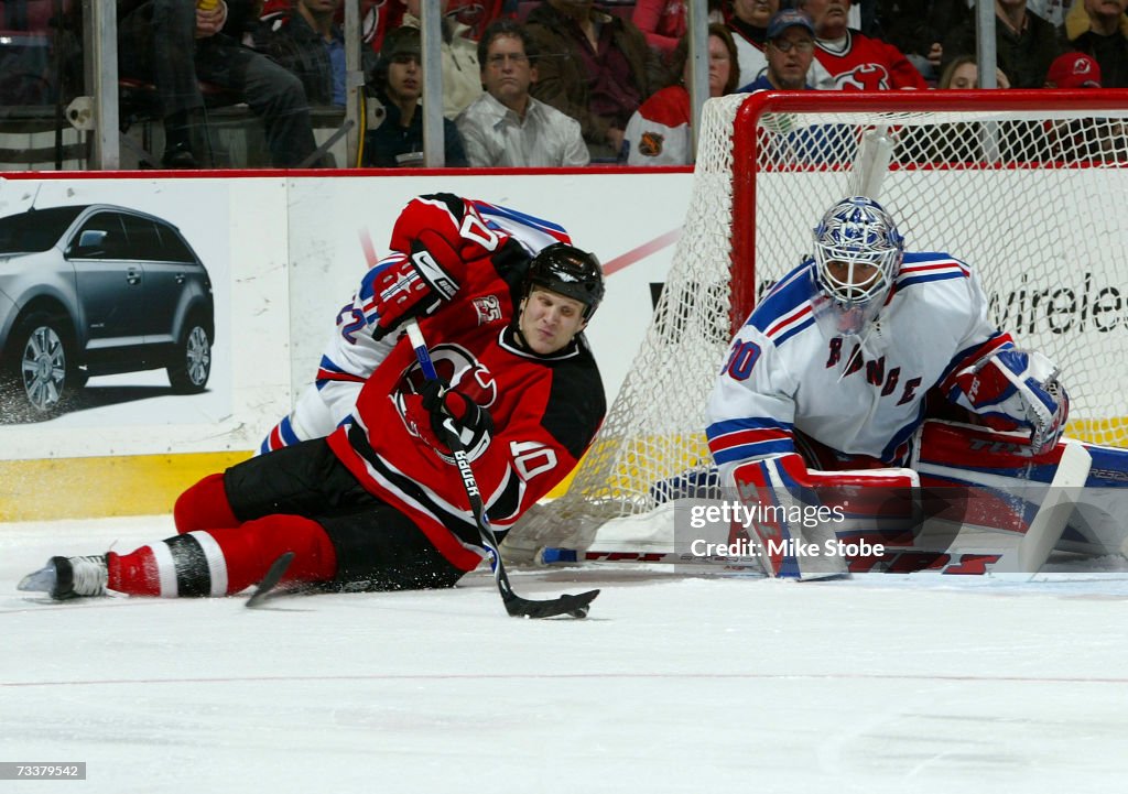 York Rasmussen Eric Rasmussen of the New Jersey Devils falls to the ice trying to ...