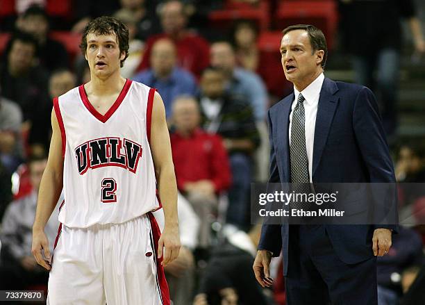 Kevin Kruger of the UNLV Rebels talks to his father, UNLV head coach Lon Kruger, during the team's game against the Air Force Falcons at the Thomas &...