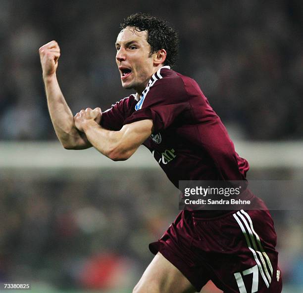Mark van Bommel of Bayern Munich celebrates after scoring the fifth goal during the UEFA Champions League round of sixteen first leg match between...