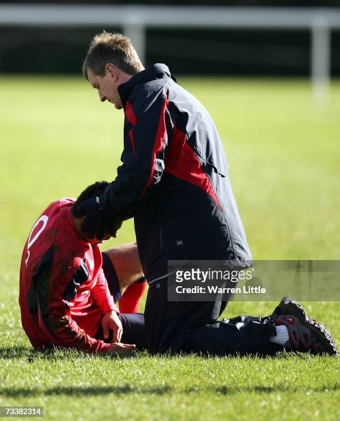 Jason Robinson of England receives treatment after making a tackle during an England rugby training session at Bath University on February 21, 2007...
