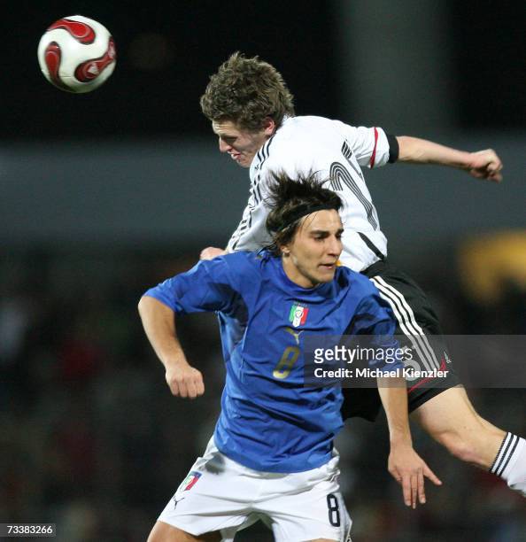 Robert Flessers of Germany vies for the ball with Simone Bentivoglio of Italy during the Under 21 friendly match between Germany and Italy at the...