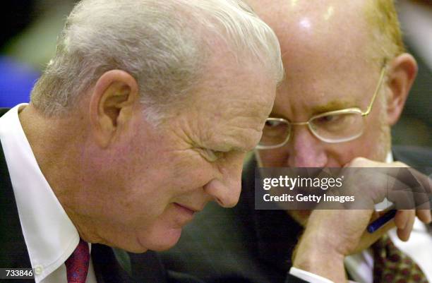 Former Secretary of State and Bush Campaign Advisor James Baker, left, talks with attorney Ben Ginsberg during a hearing at the Florida State Supreme...