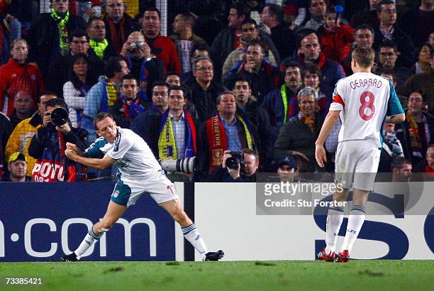 Liverpool striker Craig Bellamy celebrates with his 'Golf Swing' after scoring during the UEFA Champions league Round of 16, 1st leg match between...