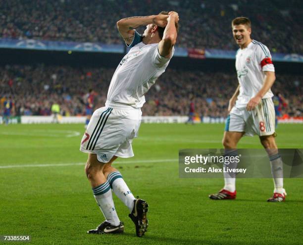 Craig Bellamy of Liverpool celebrates with a golf swing after scoring his goal during the UEFA Champions League round of 16 first leg match between...
