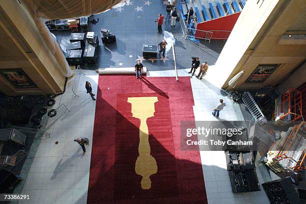 Workers lay down the red carpet for the 79th Annual Academy Awards at the Kodak Theatre February 21, 2007 in Hollywood, California. The awards are...