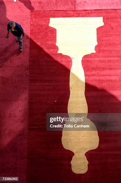 Workers lay down the red carpet for the 79th Annual Academy Awards at the Kodak Theatre February 21, 2007 in Hollywood, California. The awards are...