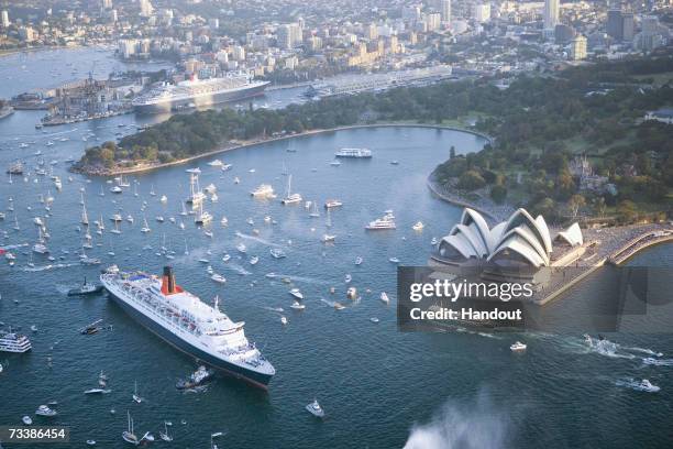 This handout image from Cunard Line shows ocean liners the Queen Mary II and the Queen Elizabeth II as she arrives in Sydney Harbour February 20,...