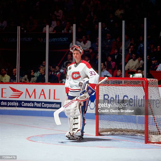 Goaltender Patrick Roy of the Montreal Canadiens looks on with his mask up during the game.