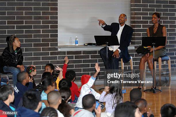 Ray Allen of the Seattle SuperSonics and Ashley Robinson of the Seattle Storm participate during the special Black History Reading Time-Out on...