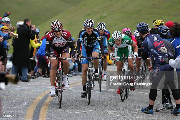 Stuart O'Grady of Australia, riding for Team CSC, Ivan Basso of Itay, riding for Discovery Channel Pro Cycling and Christophe Kern of France, riding...