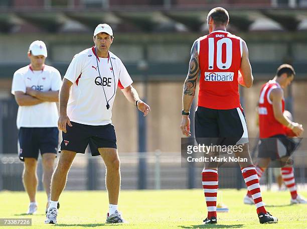 Swans coach Paul Roos instructs Peter Everitt of the Swans during the Sydney Swans AFL training session at Moore Park on February 22, 2007 in Sydney,...