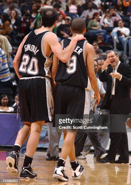 February 21: Manu Ginobili and Tony Parker of the San Antonio Spurs leave the court after defeating the Atlanta Hawks at Philips Arena on February...