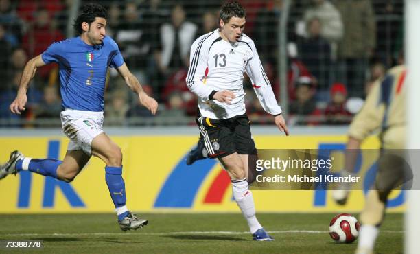 Germany's Sebastian Boenisch vies for the ball with Nicola Belmonte during the Under 21 friendly match between Germany and Italy at the Kreuzeiche...