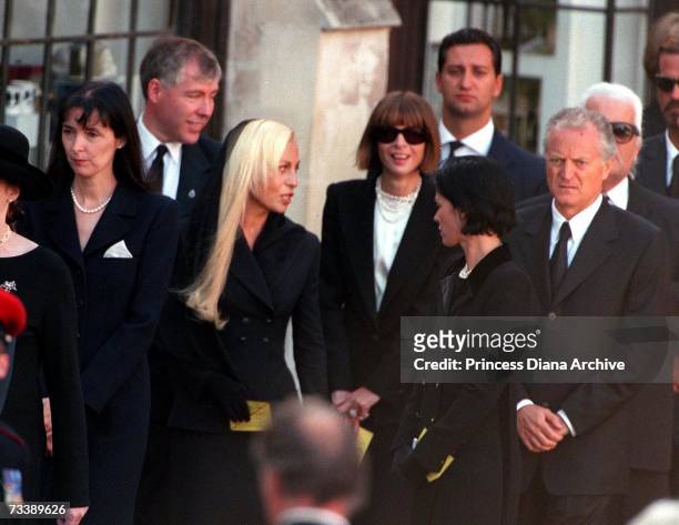 Fashion designers Catherine Walker, left, and Donatella Versace, with her brother Santos Versace, American Vogue editor Anna Wintour and Karl...
