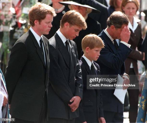 Princess Diana's sons Princes William and Harry with their father Prince Charles and uncle, Earl Spencer, outside Westminster Abbey on the day of...