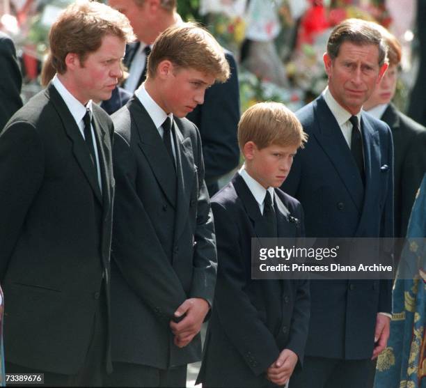 Princess Diana's sons Princes William and Harry with their father Prince Charles and uncle Earl Spencer outside Westminster Abbey on the day of their...