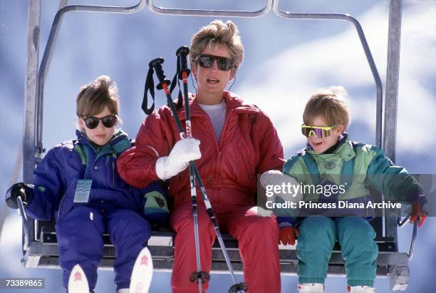 The Princess of Wales with her sons William and Harry on the chair lift during a skiing holiday in Lech, Austria, April 1991.