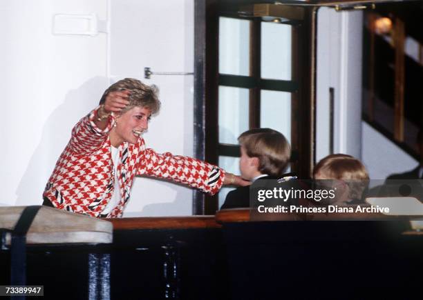 The Princess of Wales greets her sons Prince William and Prince Harry on the deck of the yacht Britannia in Toronto, when they joined their parents...