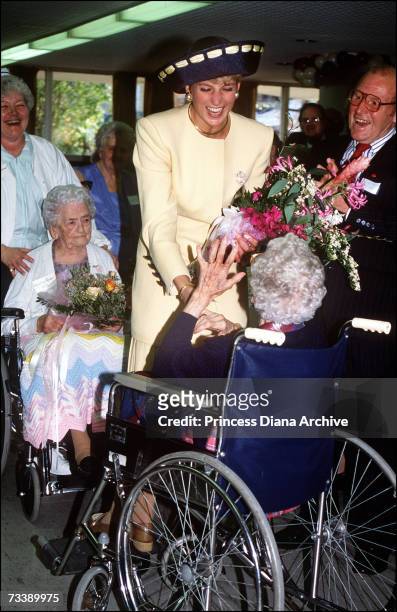 The Princess of Wales visits the Rideaucrest Home for the Aged in Kingston, during her official visit to Canada, October 1991. She is wearing a navy...