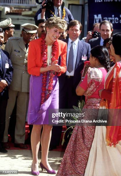 The Princess of Wales at the Marie Stopes centre in Agra, India, 11th February 1992. Diana is wearing a suit by Catherine Walker and a garland given...