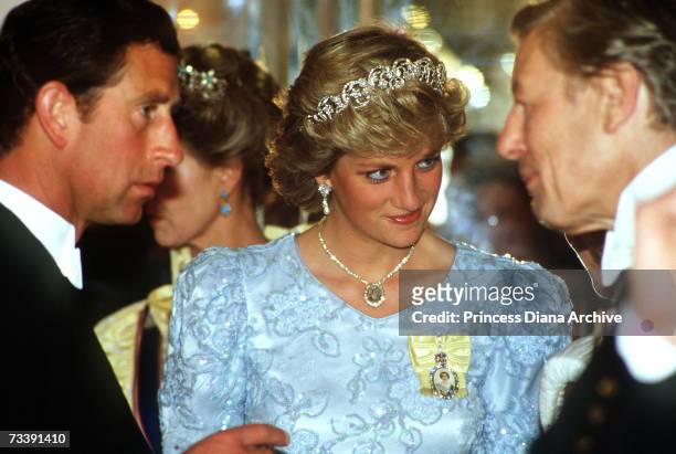 The Prince and Princess of Wales attending a state banquet held by the King of Morocco at Claridges Hotel, London, 1987. The Princess wears the...