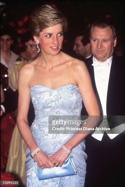 The Princes of Wales, wearing a pale blue strapless Catherine Walker gown, attending a ball for the Birthright charity at the Savoy Hotel, London,...