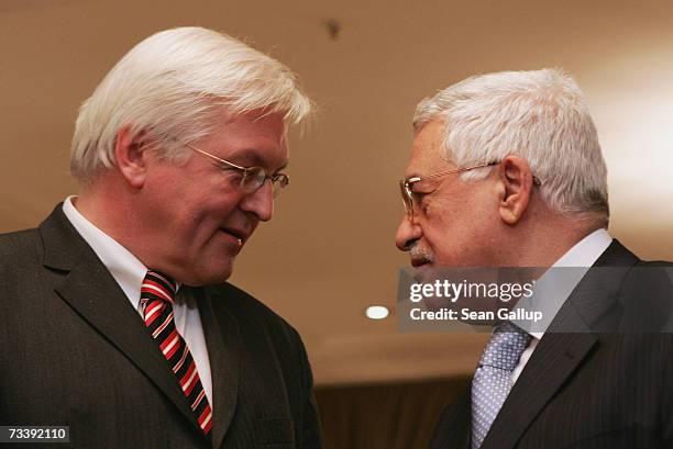 Palestinian President Mahmoud Abbas and German Foreign Minister Frank-Walter Steinmeier depart after speaking to the media, after talks at the Adlon...