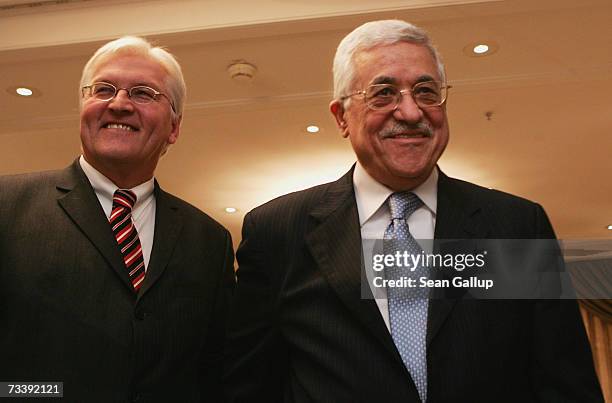 Palestinian President Mahmoud Abbas and German Foreign Minister Frank-Walter Steinmeier depart after speaking to the media after talks at the Adlon...
