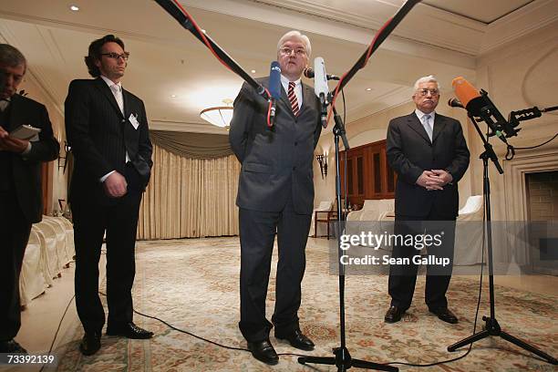 Palestinian President Mahmoud Abbas and German Foreign Minister Frank-Walter Steinmeier speak to the media after talks at the Adlon Hotel February...