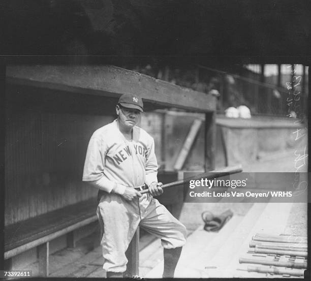 Babe Ruth standing before game in visitor's dugout. The Yankees split a doubleheaderwith the Indians at League Park, losing the first 6-0 and taking...