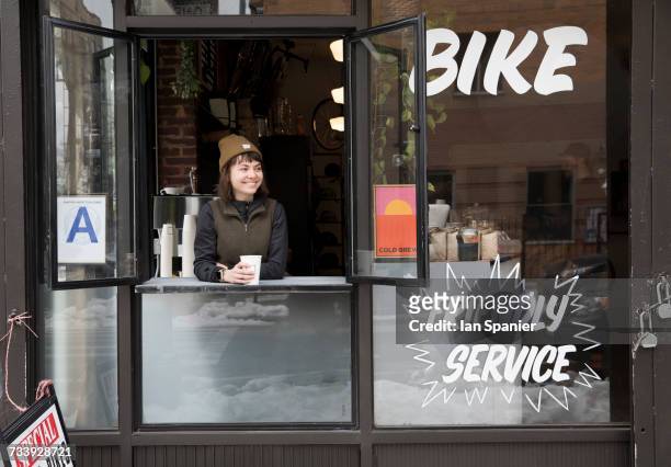 female employee at service window, nike and coffee shop, new york, usa - new york cafe stock-fotos und bilder