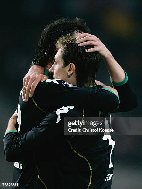 Hugo Almeida celebrates his first goal with Miroslav Klose of Bremen during the UEFA Cup round of 32 second leg match between Ajax Amsterdam and...