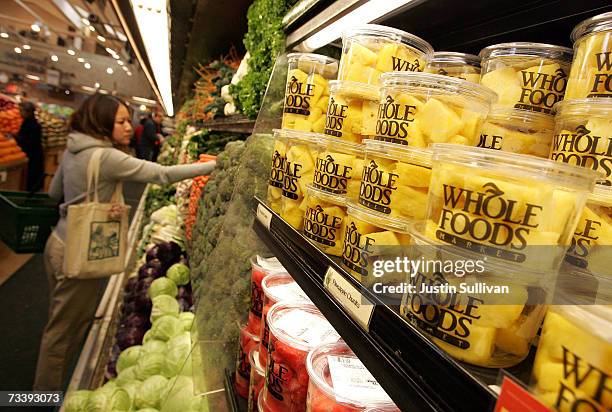 Customer shops for produce at a Whole Foods Market February 22, 2007 in San Francisco, California. Whole Foods Market Inc. Announced that it plans to...