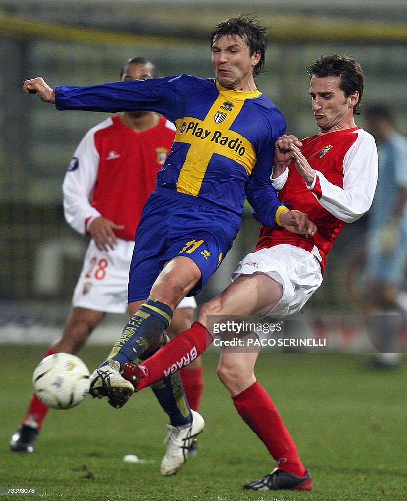 Parma's forward Vitali Kutuzov (L) fight...