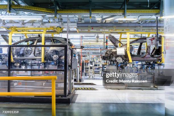 car production line in car factory - automobilbranche stock-fotos und bilder