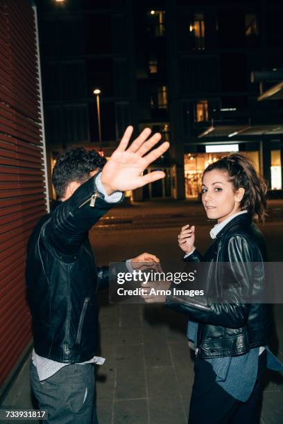 couple avoiding paparazzi, florence, italy - hands covering eyes stock pictures, royalty-free photos & images