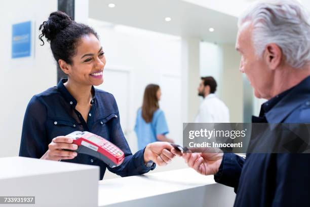 Patient Using Chip And Pin Machine In Hospital High-Res Stock Photo ...