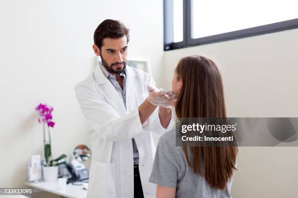 cosmetic surgeon marking patients face for surgery - plastic surgeon stock pictures, royalty-free photos & images