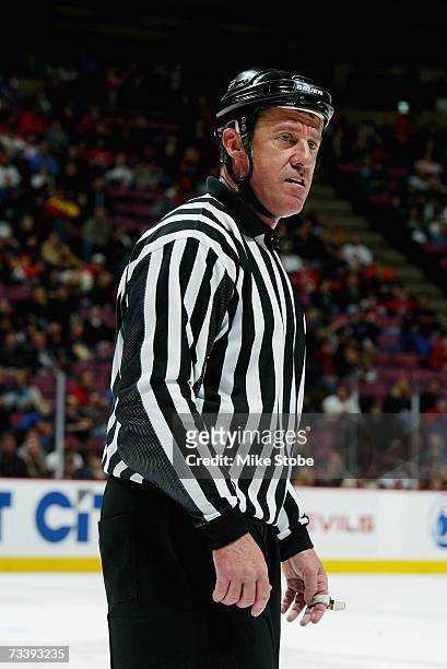 Linesman Pat Dapuzzo looks on during the New Jersey Devils game against the Pittsburgh Penguins at Continental Airlines Arena on February 16, 2007 in...