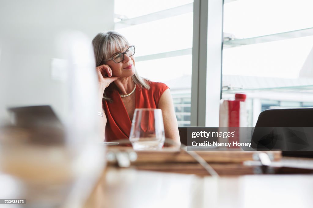 Businesswoman looking out of window