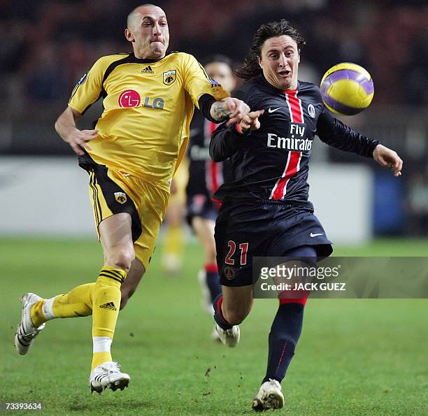 S Italian defender Bruno Cirillo vies with Paris Saint-Germain's Urugayan midfielder Cristian Rodriguez during the UEFA Cup round 32 football match...