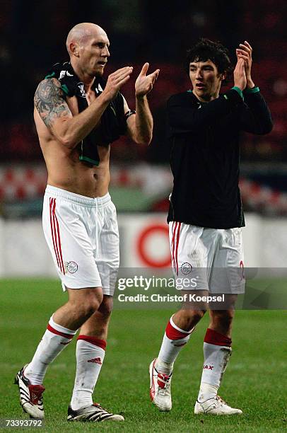 Jaap Stam and John Heitinga of Ajax applaud fans after they went out on aggragate despite of winning the match 3-1, during the UEFA Cup round of 32...