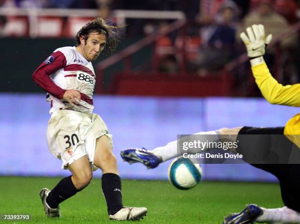 Diego Capel of Sevilla has his shot at goal blocked by Cernea of Steaua Bucharest in the second leg of their UEFA Cup round of 32 match between...