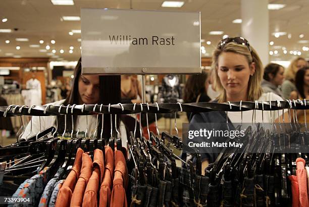 Shoppers browse through racks of William Rast jeans prior to an appearance by William Rast founder Trace Ayala at the Nordstrom International Plaza...