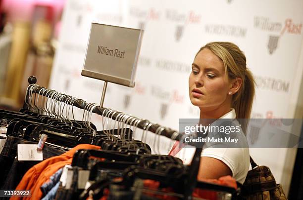 Shopper browses through racks of William Rast jeans prior to an appearance by William Rast founder Trace Ayala at the Nordstrom International Plaza...