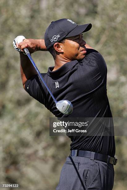 Tiger Woods hits a tee shot on the 11th hole during the second round of the WGC-Accenture Match Play Championships at the Gallery at Dove Mountain on...